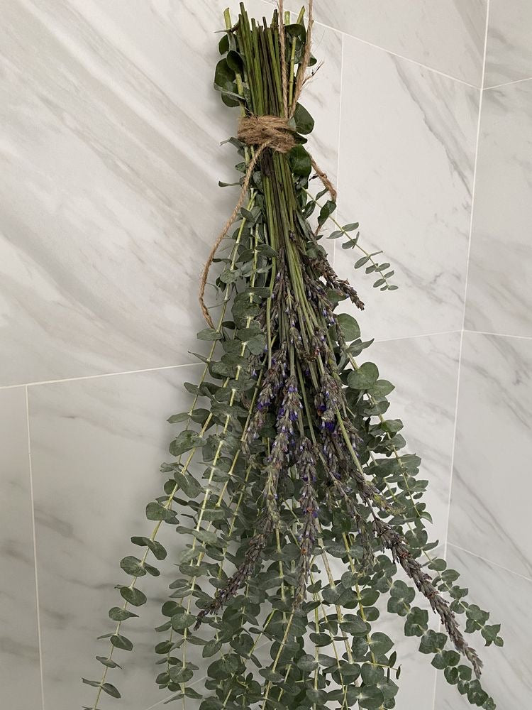 Relaxing eucalyptus in marble shower